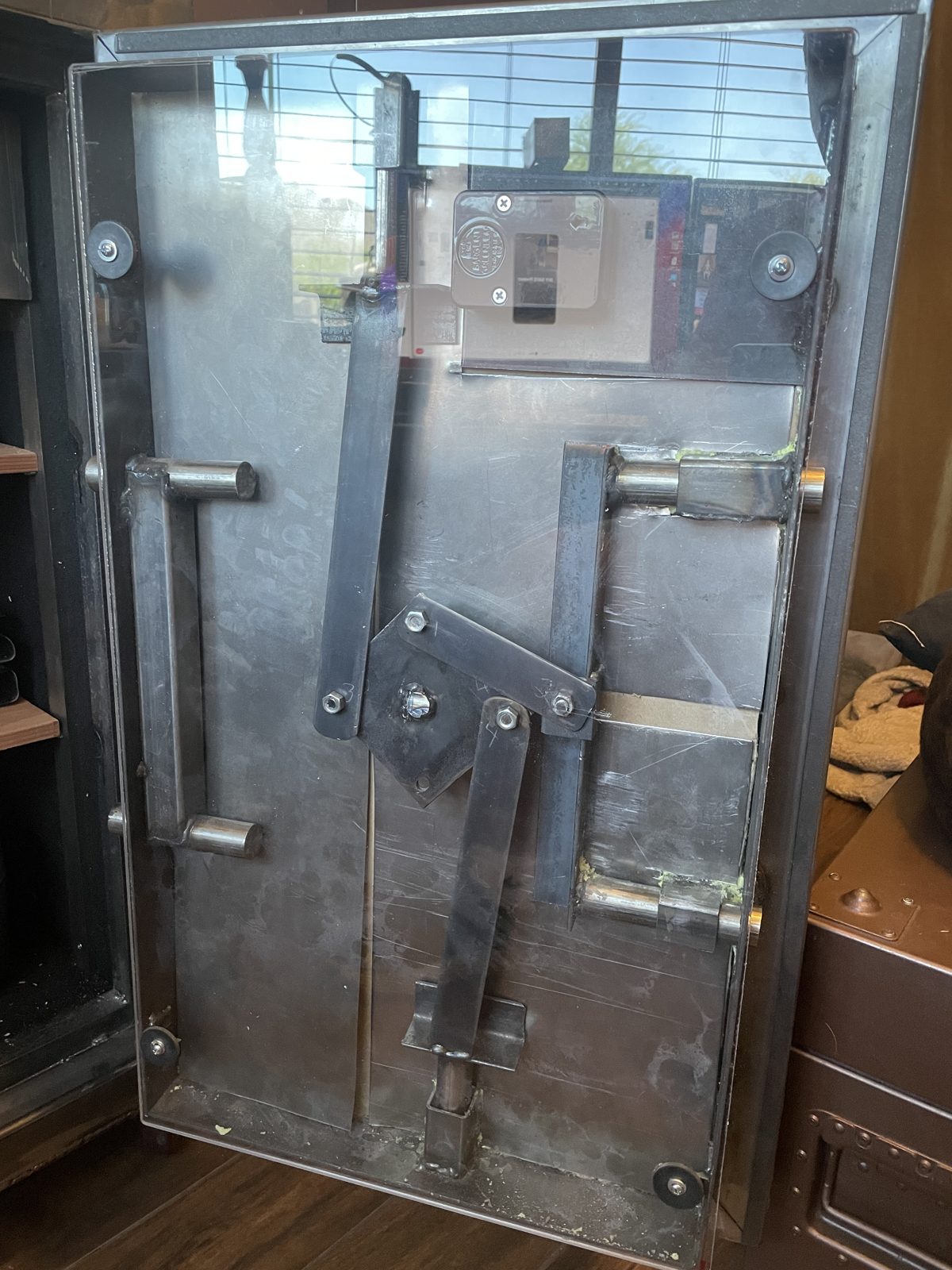 Inside the door: the bolt mechanism on display under clear plexiglass.