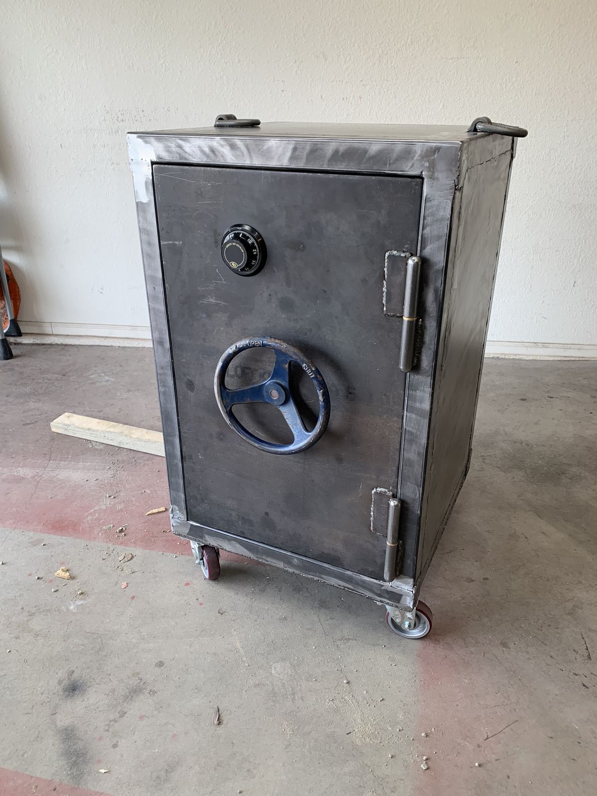 Finished safe on casters. Turn the wheel to throw the bolts.